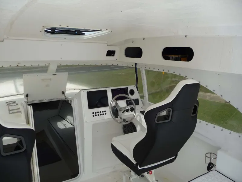 Slide: The Image of Interior of a 1985 Wellcraft Scarab 34 boat, featuring a sleek cockpit design. - 15