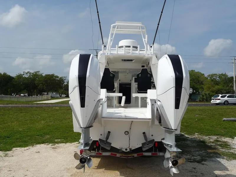 Slide: The Image of 1985 Wellcraft Scarab 34 boat with dual outboard motors, rear view. - 3