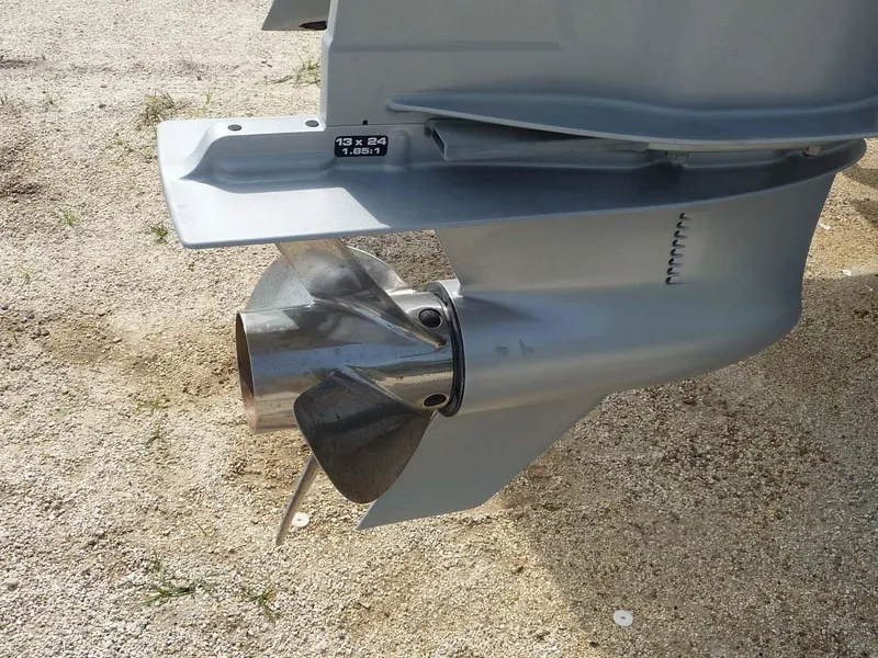 Slide: The Image of Close-up of a 1985 Wellcraft Scarab 34 boat propeller on sandy ground. - 5