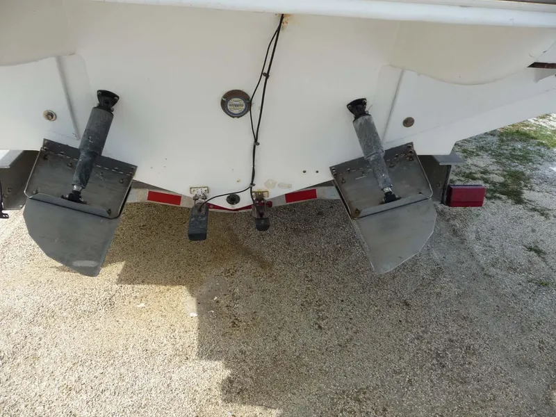 Slide: The Image of 1985 Wellcraft Scarab 34 boat stern with trim tabs on a trailer. - 7