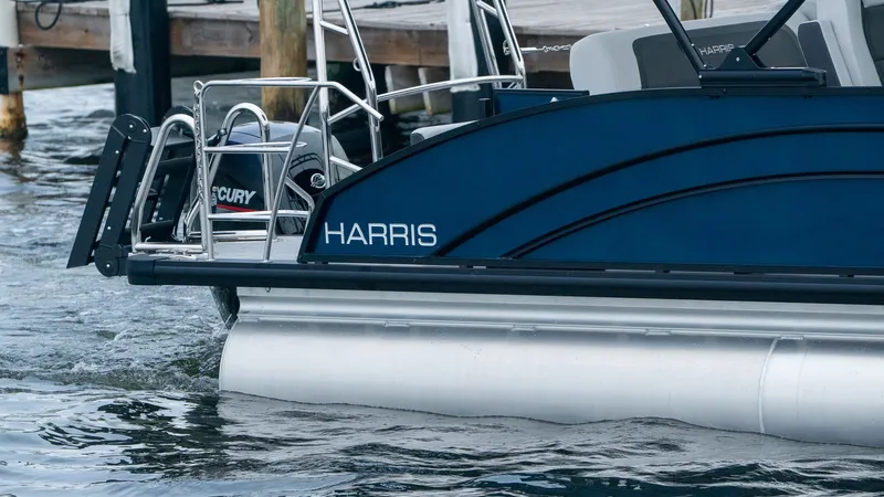 Slide: The Image of Harris Cruiser 230 boat on water, model year 2026. - 1