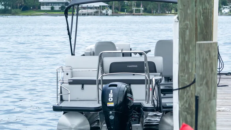 Slide: The Image of Harris Cruiser 230 boat at dock, year 2026. - 13