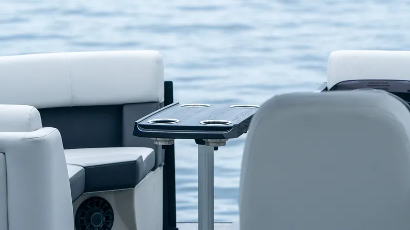 Slide: The Image of Interior of Harris Cruiser 230 pontoon boat on water. - 14