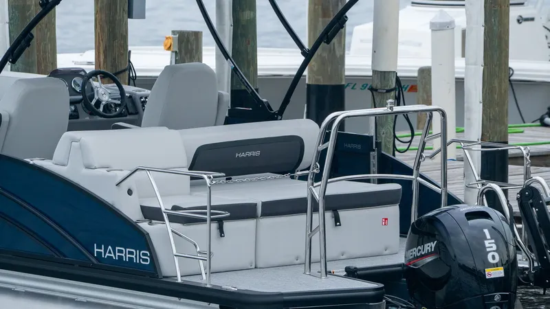 Slide: The Image of Harris Cruiser 230 boat at dock, model year 2026. - 20