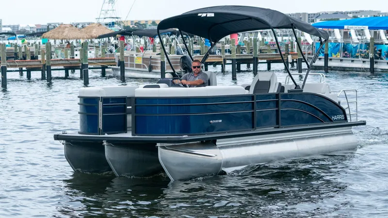 Slide: The Image of Harris Cruiser 230 pontoon boat 2026 on the water. - 3