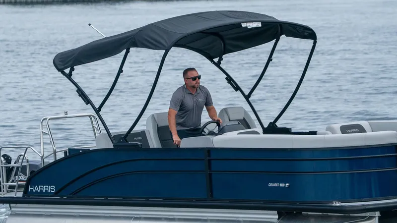 Slide: The Image of Harris Cruiser 230 boat 2026 on water with driver. - 4