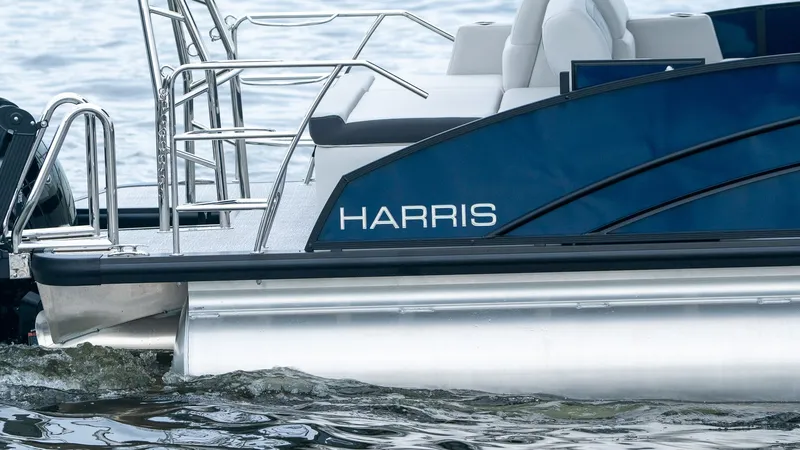 Slide: The Image of Harris Cruiser 230 boat on water, model year 2026. - 7