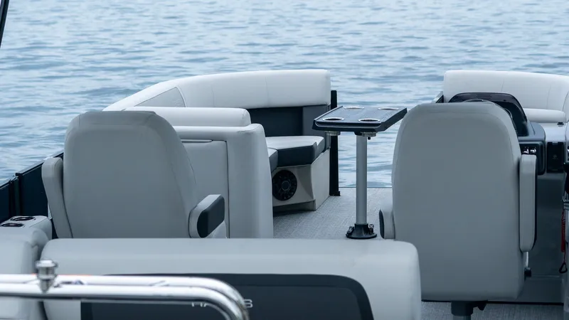 Slide: The Image of Interior of Harris Cruiser 230 pontoon boat on the water. - 8