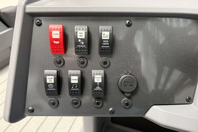 Slide: The Image of Control panel of 2026 Sylvan R 20 LZ DH boat with labeled switches. - 12