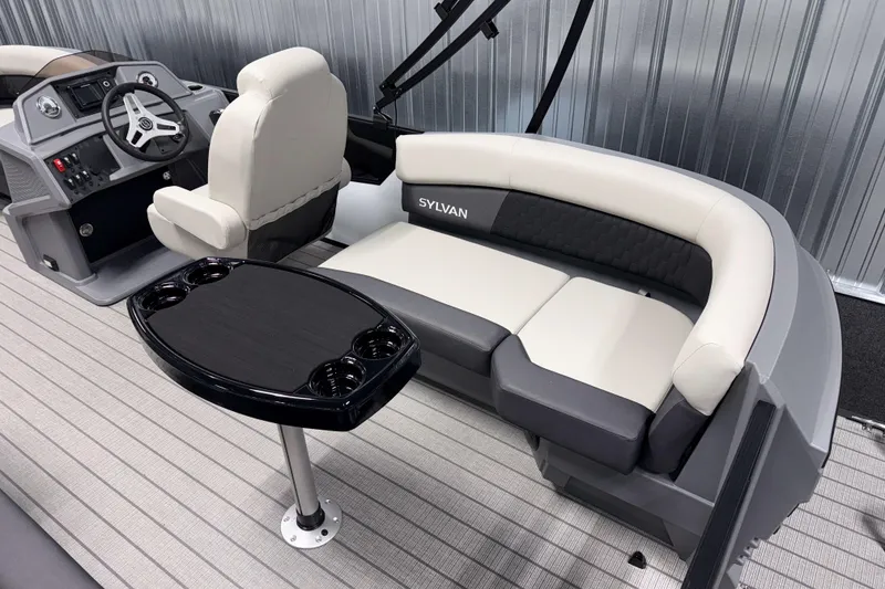 Slide: The Image of 2026 Sylvan R 20 LZ DH boat interior with seating and steering console. - 13