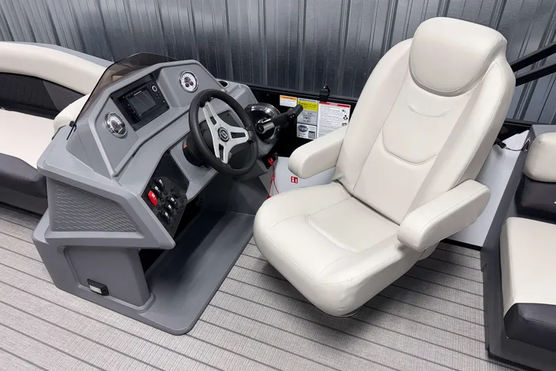 Slide: The Image of 2026 Sylvan R 20 LZ DH boat interior with modern helm and comfortable captain's chair. - 6