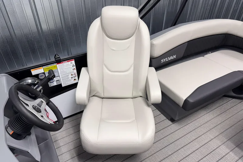 Slide: The Image of 2026 Sylvan R 20 LZ DH boat interior with steering wheel and seating. - 8
