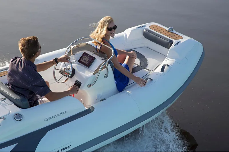 Slide: The Image of Manufacturer Provided Image: 2024 Walker Bay Generation 400 DLX inflatable boat cruising on water. - 6