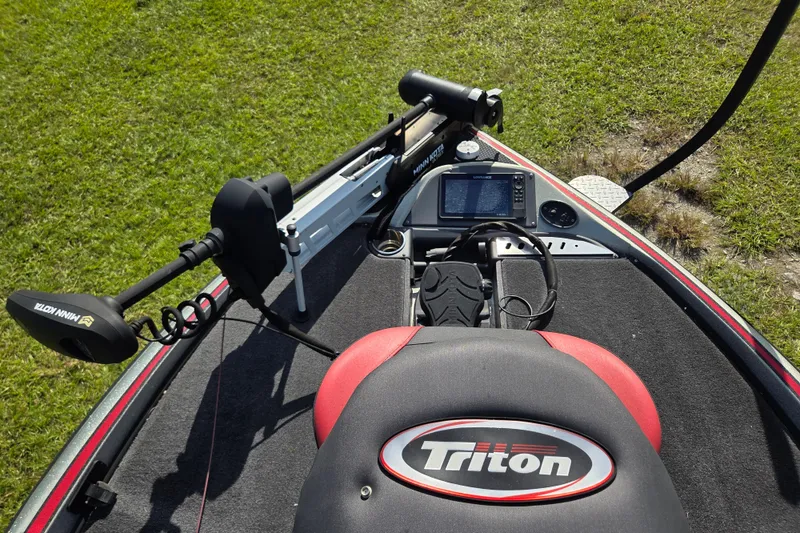 Slide: The Image of 2021 Triton 20 TrX boat with Mercury Pro XS 250 engine, parked on grass. - 10
