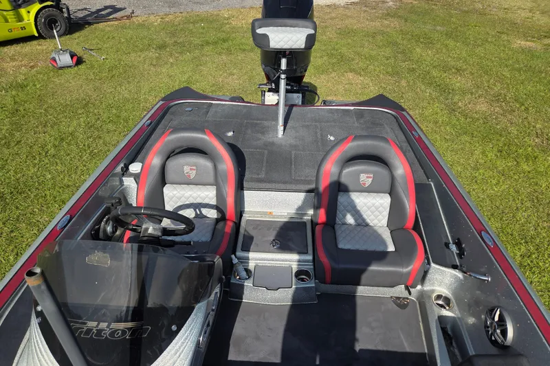 Slide: The Image of 2021 Triton 20 TrX boat with Mercury Pro XS 250 engine on grassy field. - 8