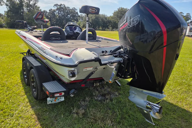 Slide: The Image of 2021 Triton 20 TrX boat interior with Minn Kota trolling motor and navigation system. - 9