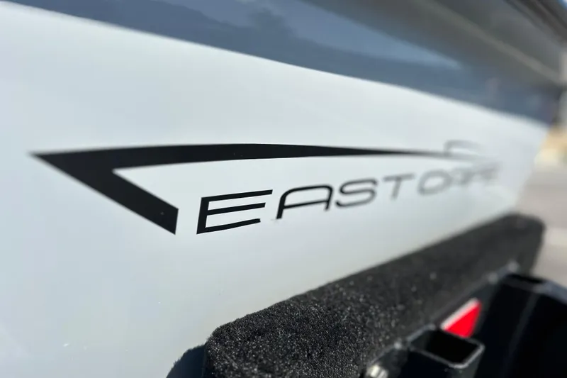 Slide: The Image of Close-up of 2025 East Cape VHP boat logo on sleek white surface. - 15