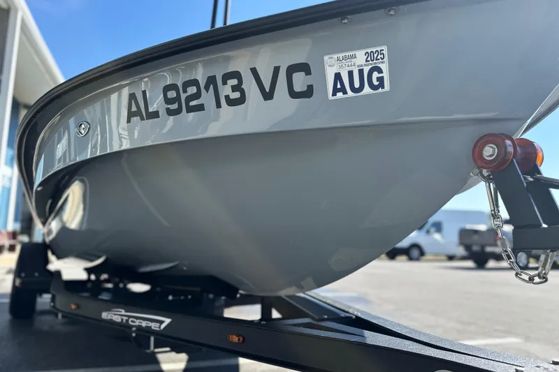 Slide: The Image of 2025 East Cape VHP boat on trailer, Alabama registration visible. - 20