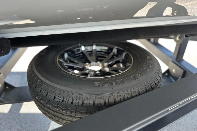 Slide: The Image of 2025 East Cape VHP trailer tire with black alloy wheel, close-up view. - 22