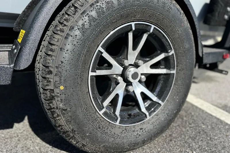 Slide: The Image of Close-up of a 2025 East Cape VHP vehicle tire and alloy wheel. - 23