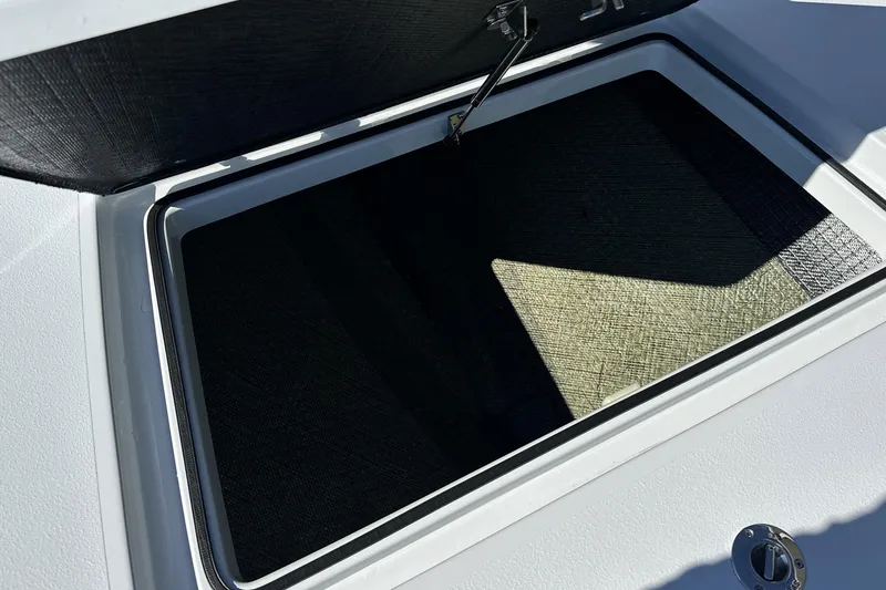 Slide: The Image of Open storage compartment on 2025 East Cape VHP boat, showcasing interior details. - 30