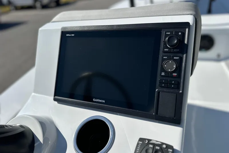 Slide: The Image of 2025 East Cape VHP boat dashboard with Garmin GPS system. - 31
