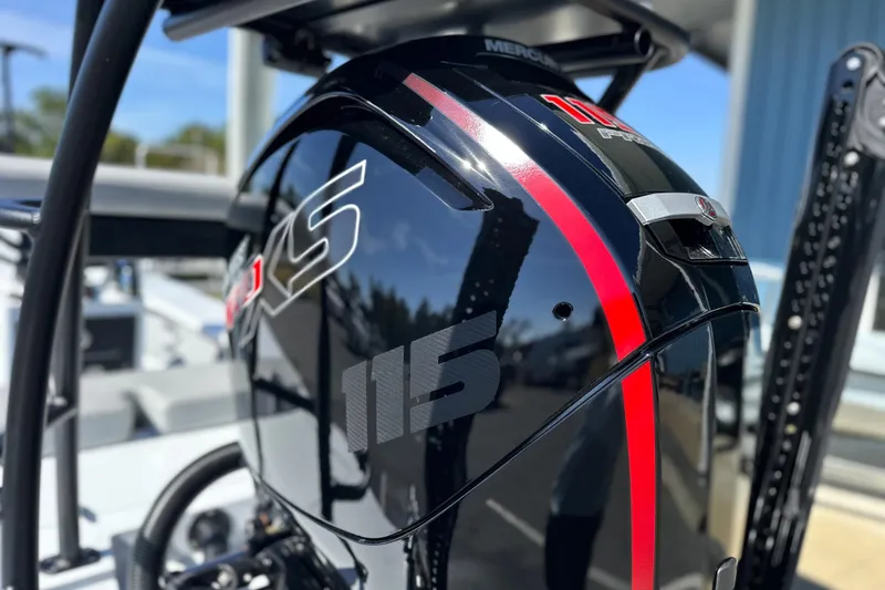 Slide: The Image of 2025 East Cape VHP boat with a sleek black and red Mercury 115 Pro XS engine. - 5