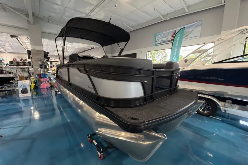 Slide: The Image of 2026 Godfrey Monaco 235ULC boat with Yamaha 300 V6 engine displayed indoors. - 11