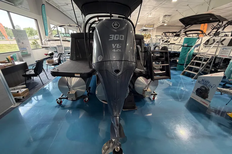 Slide: The Image of Steering console of 2026 Godfrey Monaco 235ULC pontoon boat with modern controls and seating. - 12