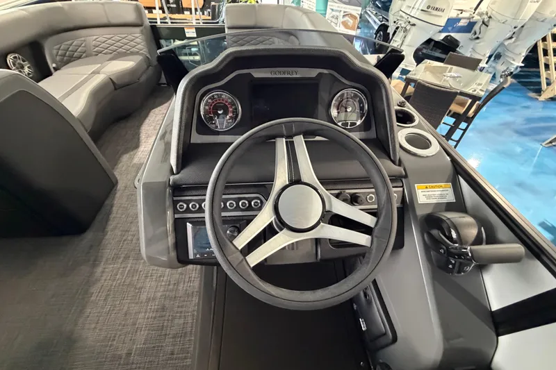 Slide: The Image of Luxurious interior of 2026 Godfrey Monaco 235ULC pontoon boat with plush seating and modern design. - 13