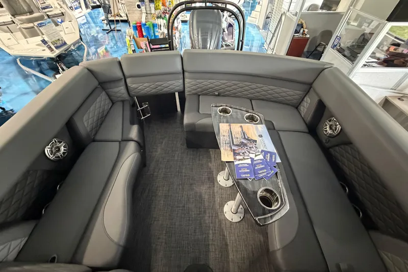 Slide: The Image of Interior of 2026 Godfrey Monaco 235ULC pontoon boat with luxurious seating and modern design. - 14