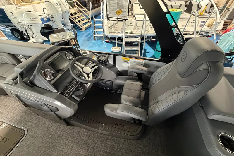 Slide: The Image of 2026 Godfrey Monaco 235ULC boat deck with motor, showroom display. - 17