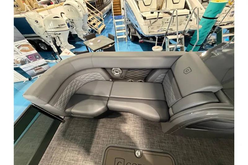 Slide: The Image of Luxurious seating on 2026 Godfrey Monaco 235ULC boat, featuring elegant gray upholstery. - 7