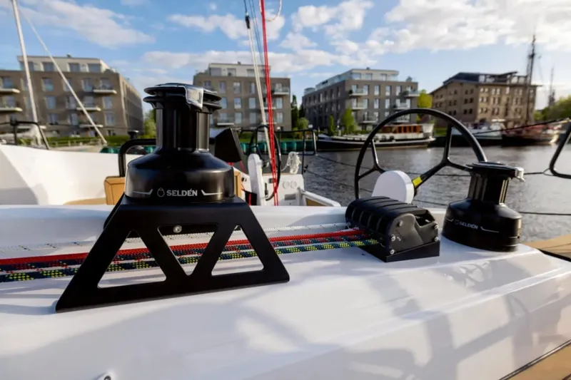 Slide: The Image of Deck view of 2026 Hanse 360 ST sailboat with winches and colorful ropes. - 21