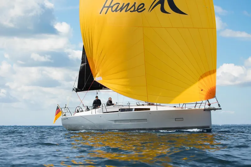 Slide: The Image of Sailing yacht Hanse 360 ST 2026 with yellow sail on open water. - 4