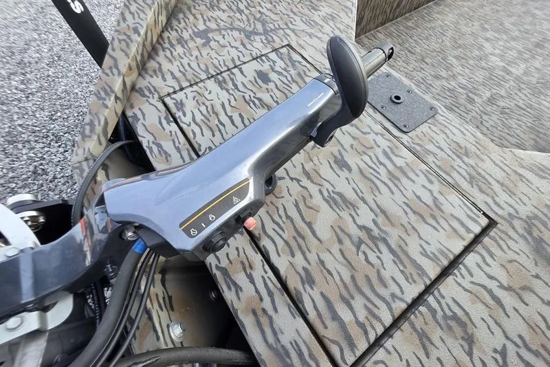 Slide: The Image of Close-up of 2026 Xpress X18DB boat engine mount with caution labels. - 14