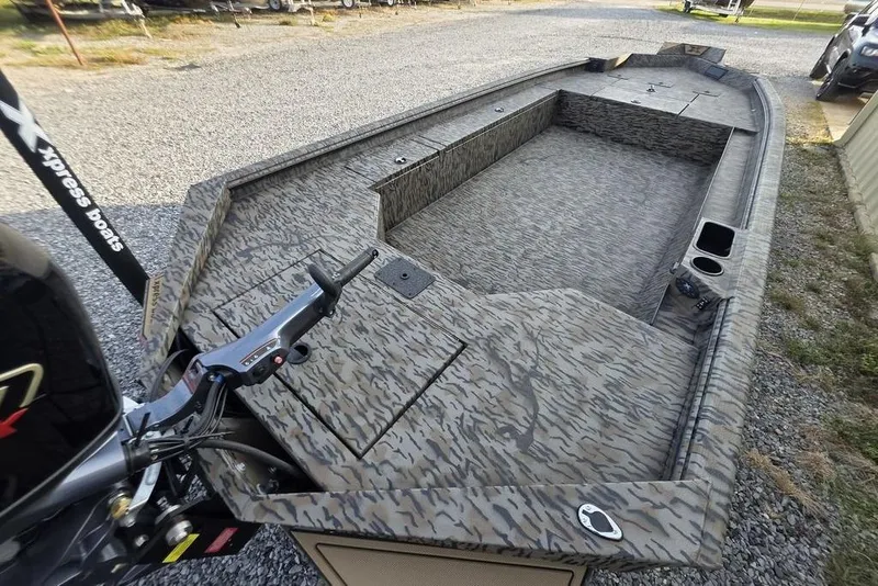 Slide: The Image of 2026 Xpress X18DB boat interior with camouflage pattern design. - 24