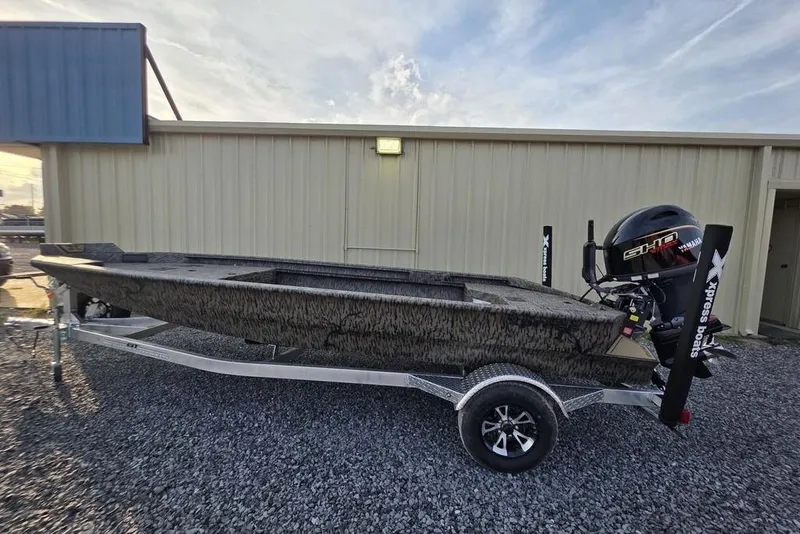 Slide: The Image of 2026 Xpress X18DB boat logo with textured surface and duck silhouette. - 3