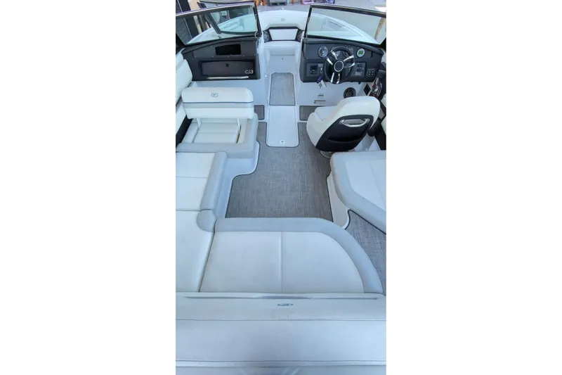Slide: The Image of 2020 Cobalt CS23 Surf boat interior with luxurious seating and modern dashboard. - 10