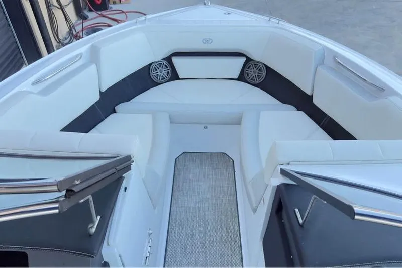 Slide: The Image of 2020 Cobalt CS23 Surf boat interior with white seating and modern design. - 3