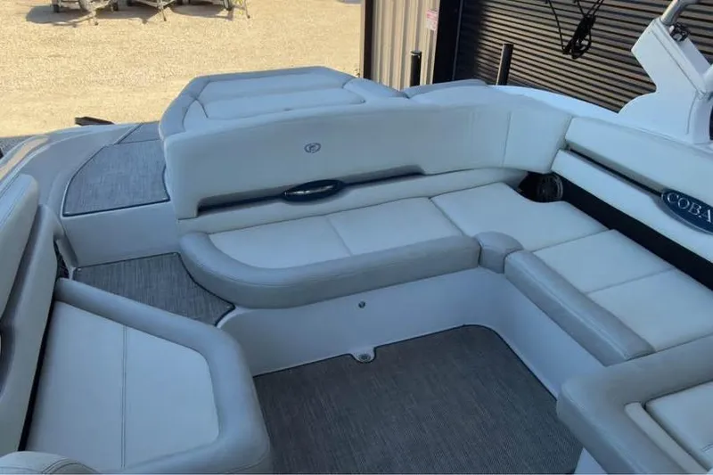 Slide: The Image of 2020 Cobalt CS23 Surf boat interior with cushioned seating and sleek design. - 8