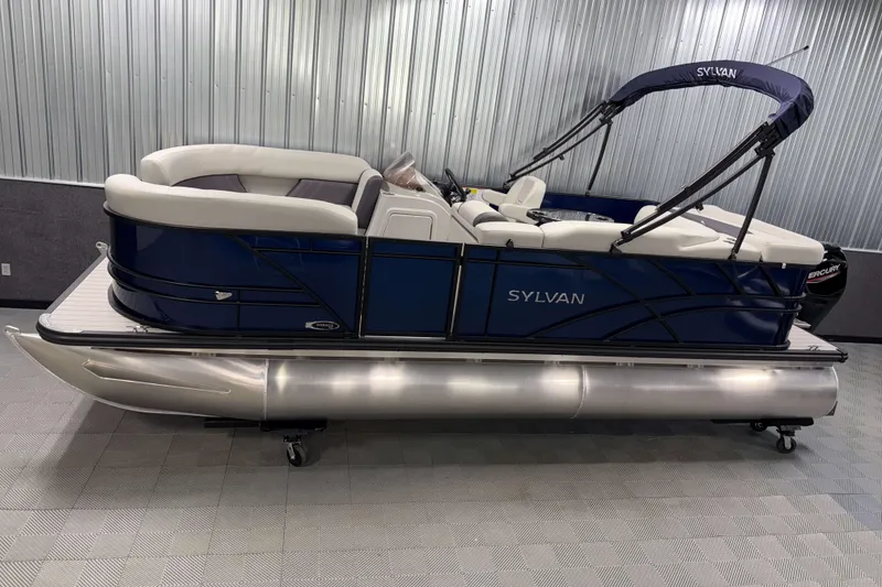 The Image of 2026 Sylvan Mirage 820 Cruise pontoon boat in showroom, featuring sleek design and comfortable seating. - 0