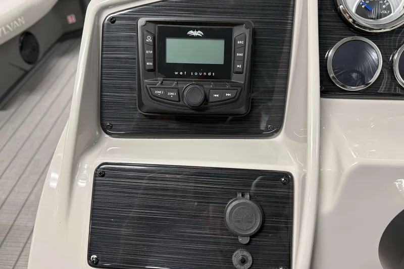 Slide: The Image of Dashboard of 2026 Sylvan Mirage 820 Cruise with audio controls and gauges. - 12