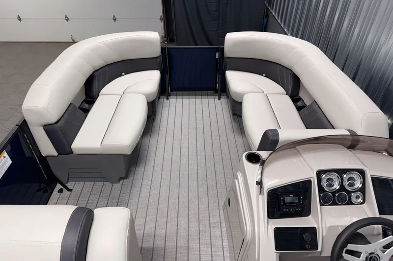 Slide: The Image of 2026 Sylvan Mirage 820 Cruise interior with plush seating and modern dashboard. - 4