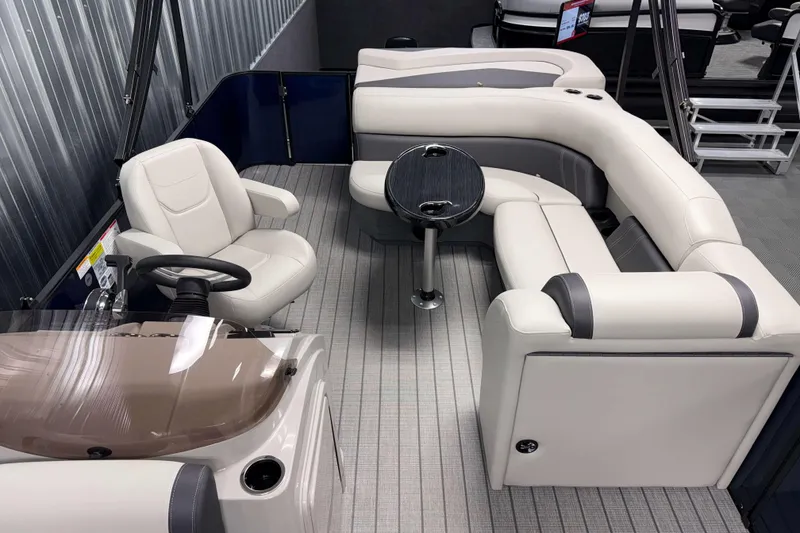 Slide: The Image of 2026 Sylvan Mirage 820 Cruise interior with plush seating and modern helm. - 5