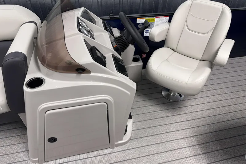 Slide: The Image of 2026 Sylvan Mirage 820 Cruise boat interior with helm and captain's chair. - 6