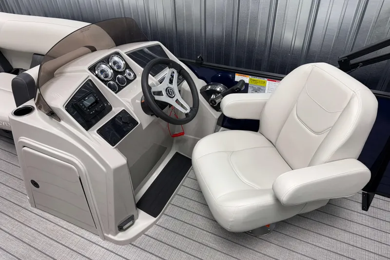 Slide: The Image of 2026 Sylvan Mirage 820 Cruise boat interior with steering console and plush captain's chair. - 7
