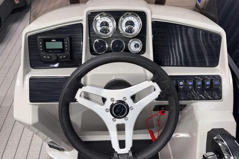 Slide: The Image of 2026 Sylvan Mirage 820 Cruise dashboard with steering wheel and control panel. - 9