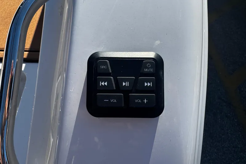 Slide: The Image of Audio control panel on 2026 Sea Pro 245FLX Sandbar boat dashboard. - 11