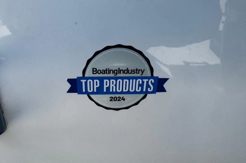 Slide: The Image of Boating Industry Top Products 2024 award badge on Sea Pro 245FLX Sandbar 2026 model. - 12